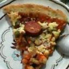 A picture of Pizza (Chicken and vegetables) with ghee.