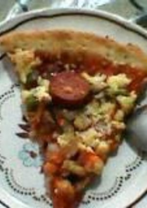 A picture of Pizza (Chicken and vegetables) with ghee.