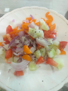 A picture of Simple tomato cucumber salad.