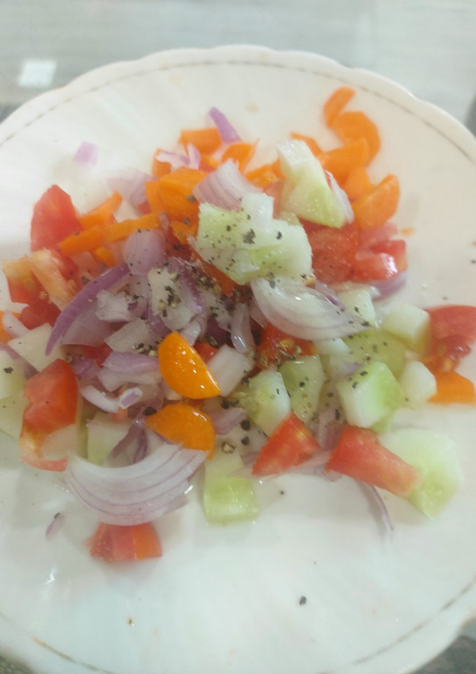 A picture of Simple tomato cucumber salad.