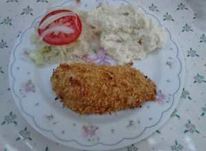 Una foto de Corn Pollo (Empanizado con hojuelas)
