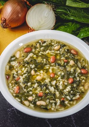 A picture of Arborio Rice Soup with Beans and Swiss Chard.