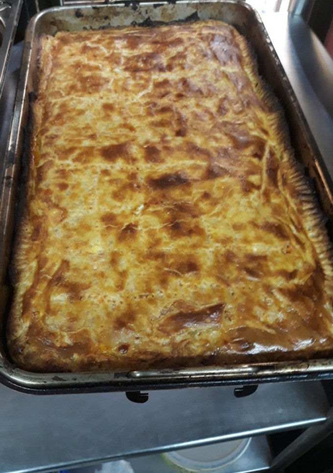 Una foto de Empanada de atún y tomate