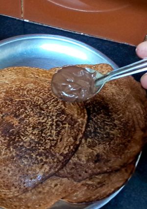 A picture of Banana pancake with nutella.
