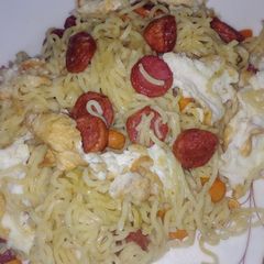 A picture of Indomie and sausage with egg.