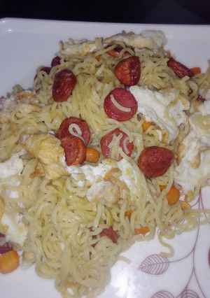 A picture of Indomie and sausage with egg.