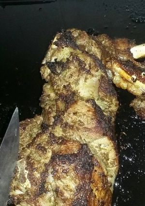 A picture of Roast leg of a lamb with mint, lemon and cumin.