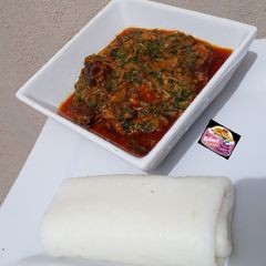 A picture of Tuwon Shinkafa (Mashed Rice) and Groundnut Soup (Miyan Gyada).