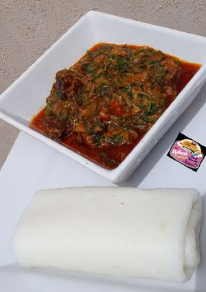 A picture of Tuwon Shinkafa (Mashed Rice) and Groundnut Soup (Miyan Gyada).