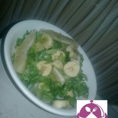 A picture of Mixed lettuce with Orange and banana.