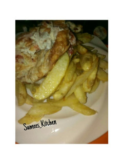 A picture of Chips and fried Egg.
