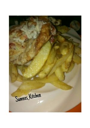 A picture of Chips and fried Egg.