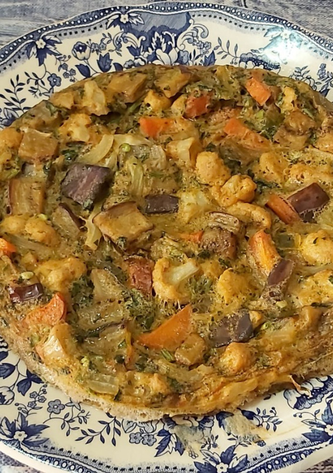 Una foto de Tortilla de coliflor y berenjena