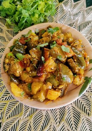 A picture of Potato, Brinjal Dry Curry With Mixed Mustard Powder.