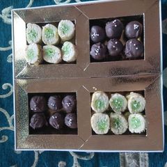 A picture of Kaju pista roll and Oreo chocolates.