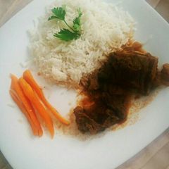 A picture of White rice and beef stew.