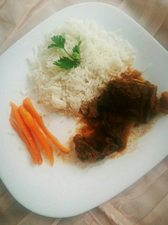 A picture of White rice and beef stew.