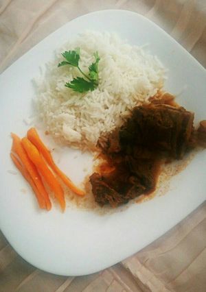 A picture of White rice and beef stew.
