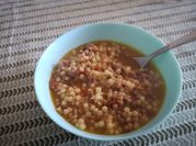 Una foto di fregola con salsiccia