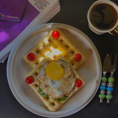 A picture of Poached Egg on a Savoury Waffle.