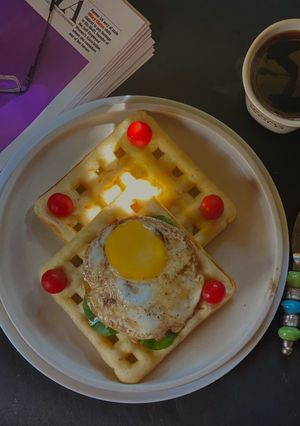 A picture of Poached Egg on a Savoury Waffle.