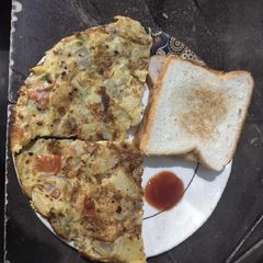 Spanish omlete with bread A picture of Spanish omlete with bread.