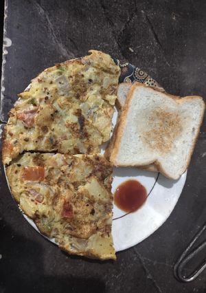 A picture of Spanish omlete with bread.