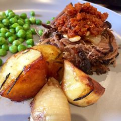 A picture of Amazing Slow Roasted Beef Brisket with a Sun Dried Tomato Tapenade.