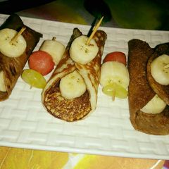 A picture of Fruits stuffed chocolate pancakes.