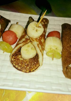 A picture of Fruits stuffed chocolate pancakes.