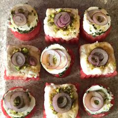 A picture of Watermelon feta cheese and soft cheese canapés.