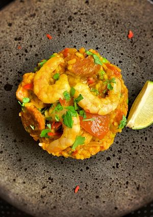 A picture of Paella, chicken, chorizo & prawns.