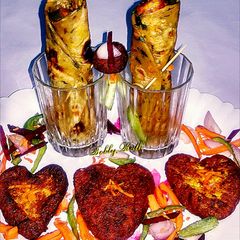 Chilli cottage cheese hearts in spinach carrot wraper A picture of Chilli cottage cheese hearts in spinach carrot wraper.