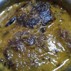 A picture of Raw banana potato kofta curry.