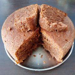 A picture of Eggless Whole wheat chocolate cake in cooker.