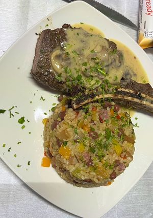 Una foto de Arroz Manposteao y T-Bone Steak