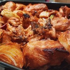 A picture of Chicken in oven.