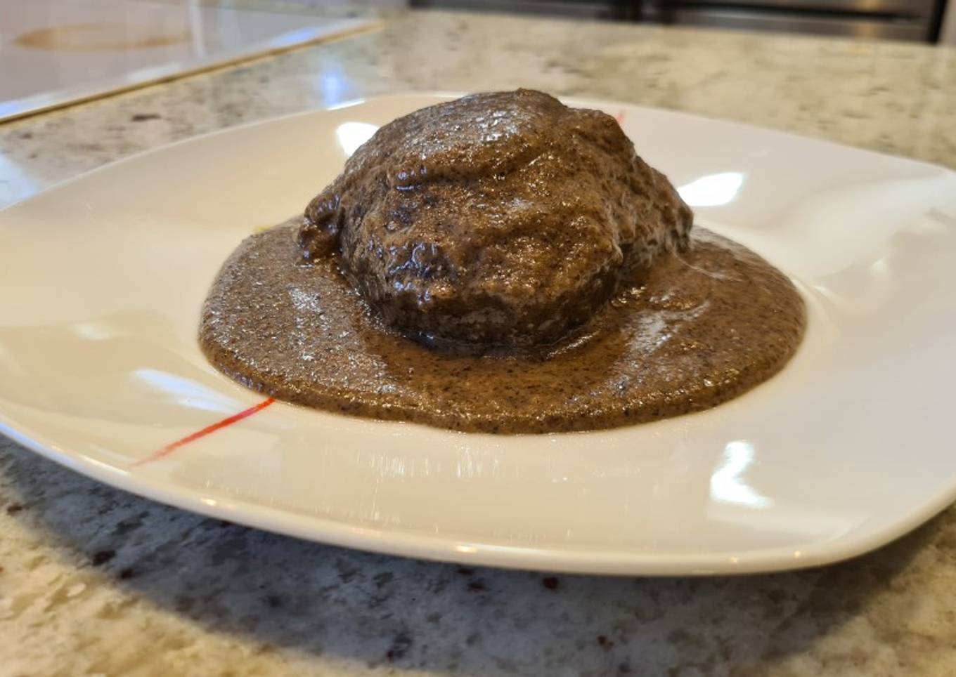 Carrillera de ternera en salsa de champiñones y queso