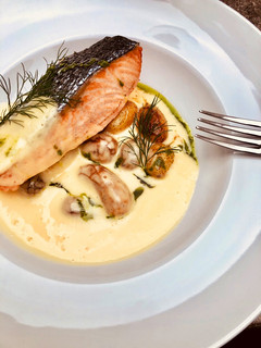 A picture of Pan seared wild Salmon with roasted potato and béarnaise sauce.