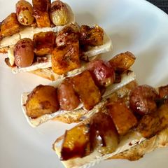 A picture of Roasted Grape and Butternut SquashBruschetta with Camembert Cheese.