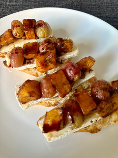 A picture of Roasted Grape and Butternut SquashBruschetta with Camembert Cheese.