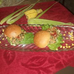 A picture of Corn Spinach burger with white sauce 👌.