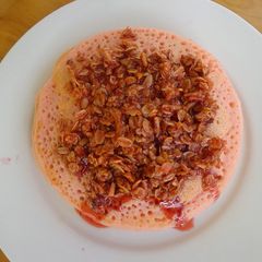 A picture of Strawberry Pancakes with Granola syrup.