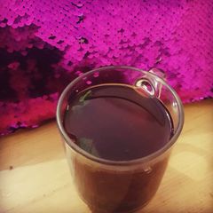 A picture of Black Tea with mint leaves.