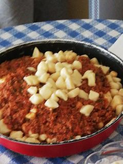 Una foto de Gnocchis caseros con salsa boloñesa