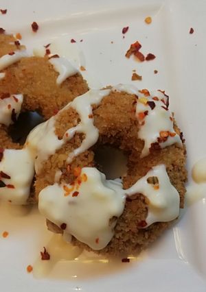 A picture of Chicken donuts with Cheese sauce.