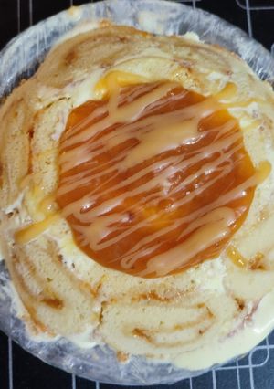 A picture of Peach Swiss roll Ice cream Cake.