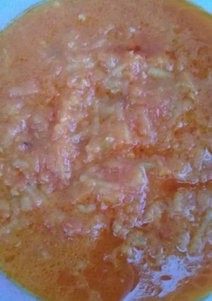A picture of Tomato gravy with potato.