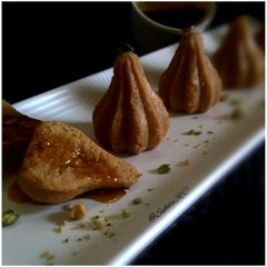 A picture of Nolen Gur er jolbhara sandesh (date palm jaggery sandesh).