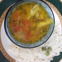 A picture of Tomato drumstick daal.